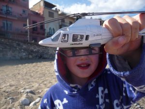 Boy playing with toy helicopter as fertility over 40 success story